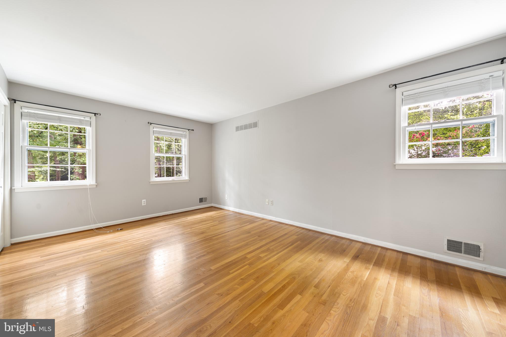 1643 Homewood Road Annapolis, MD 21409 - Photo 35 of 59 a view of an empty room with wooden floor and a window