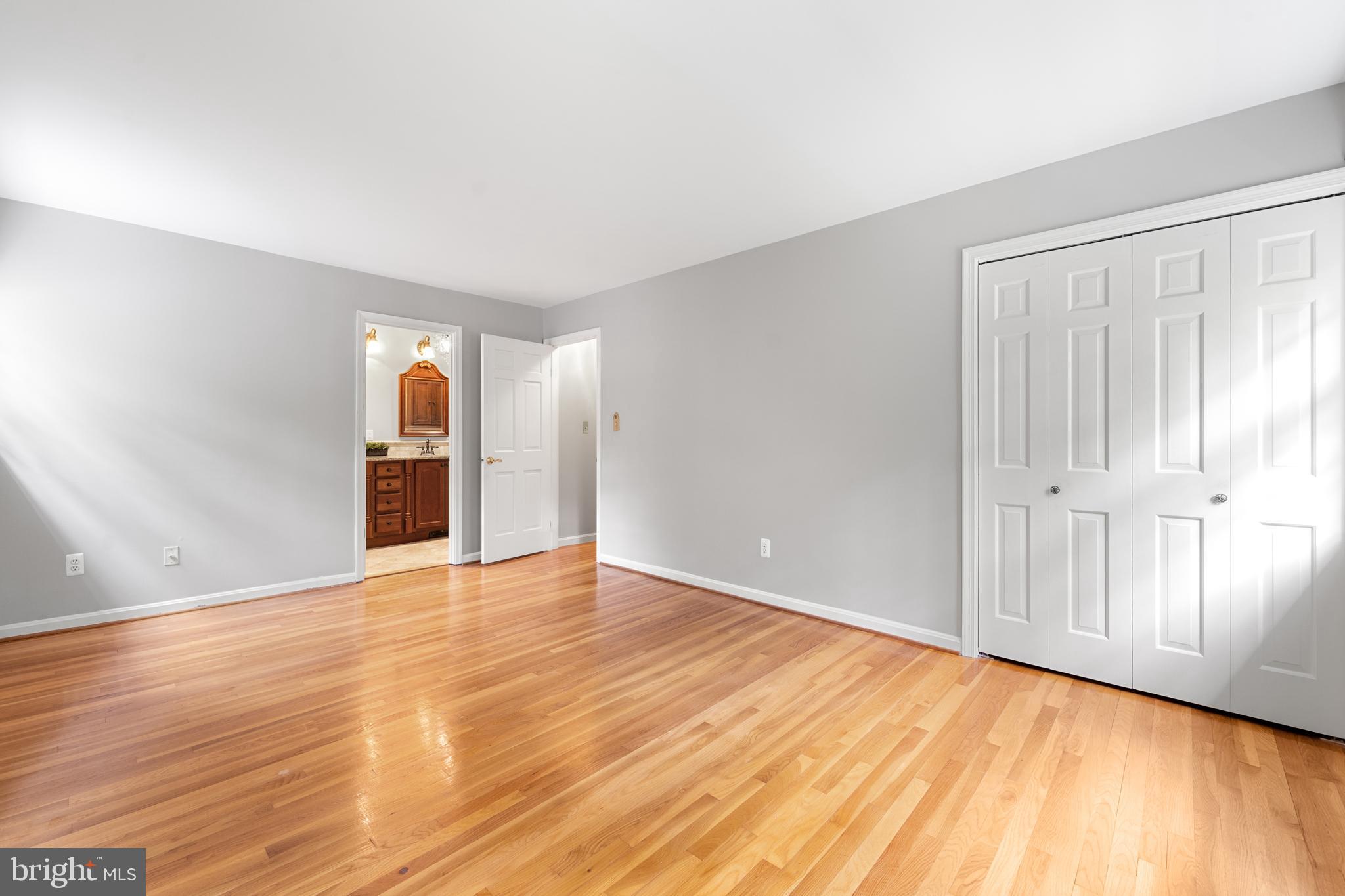1643 Homewood Road Annapolis, MD 21409 - Photo 36 of 59 wooden floor in an empty room with a window
