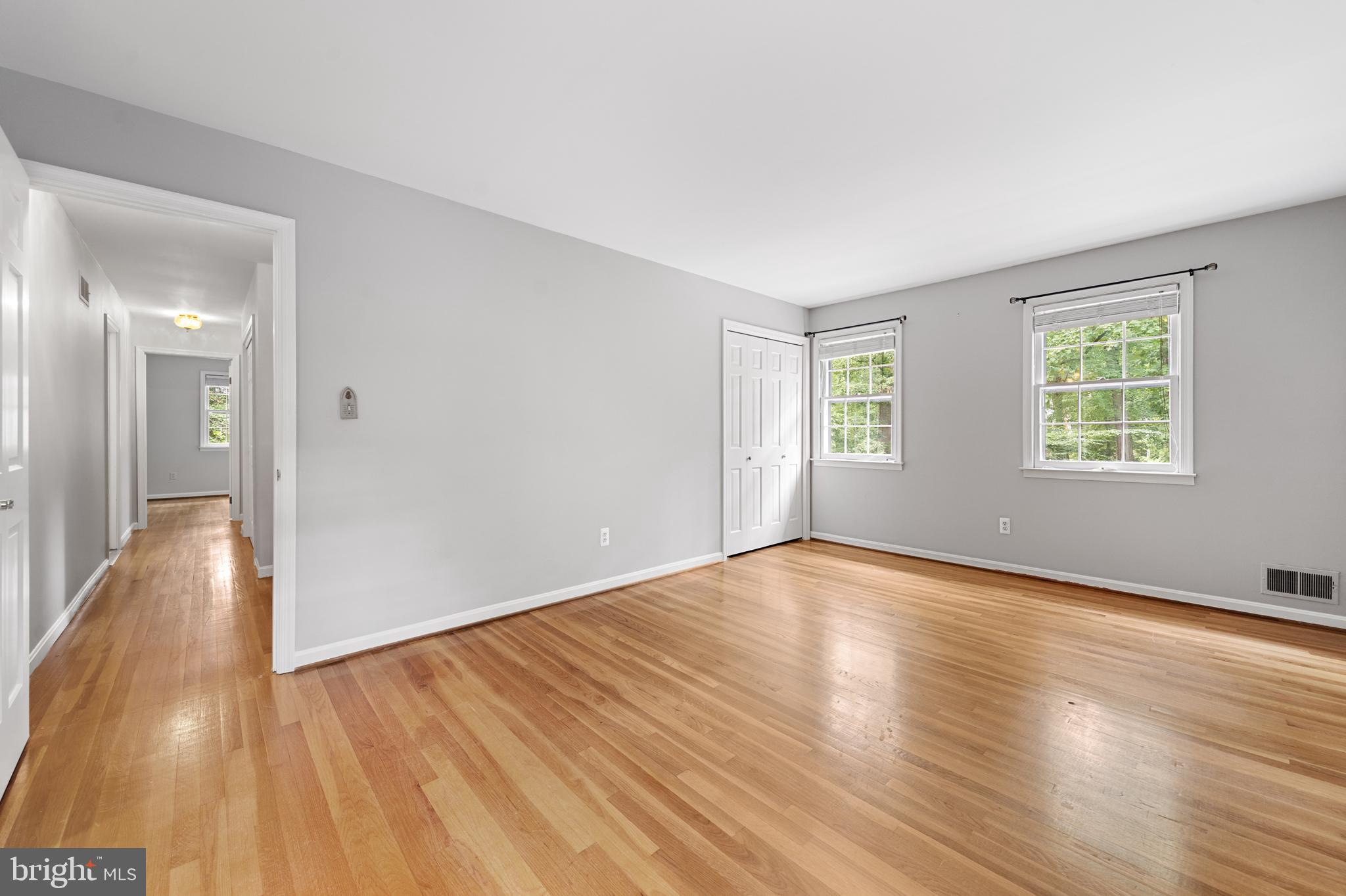 1643 Homewood Road Annapolis, MD 21409 - Photo 37 of 59 an empty room with wooden floor and windows