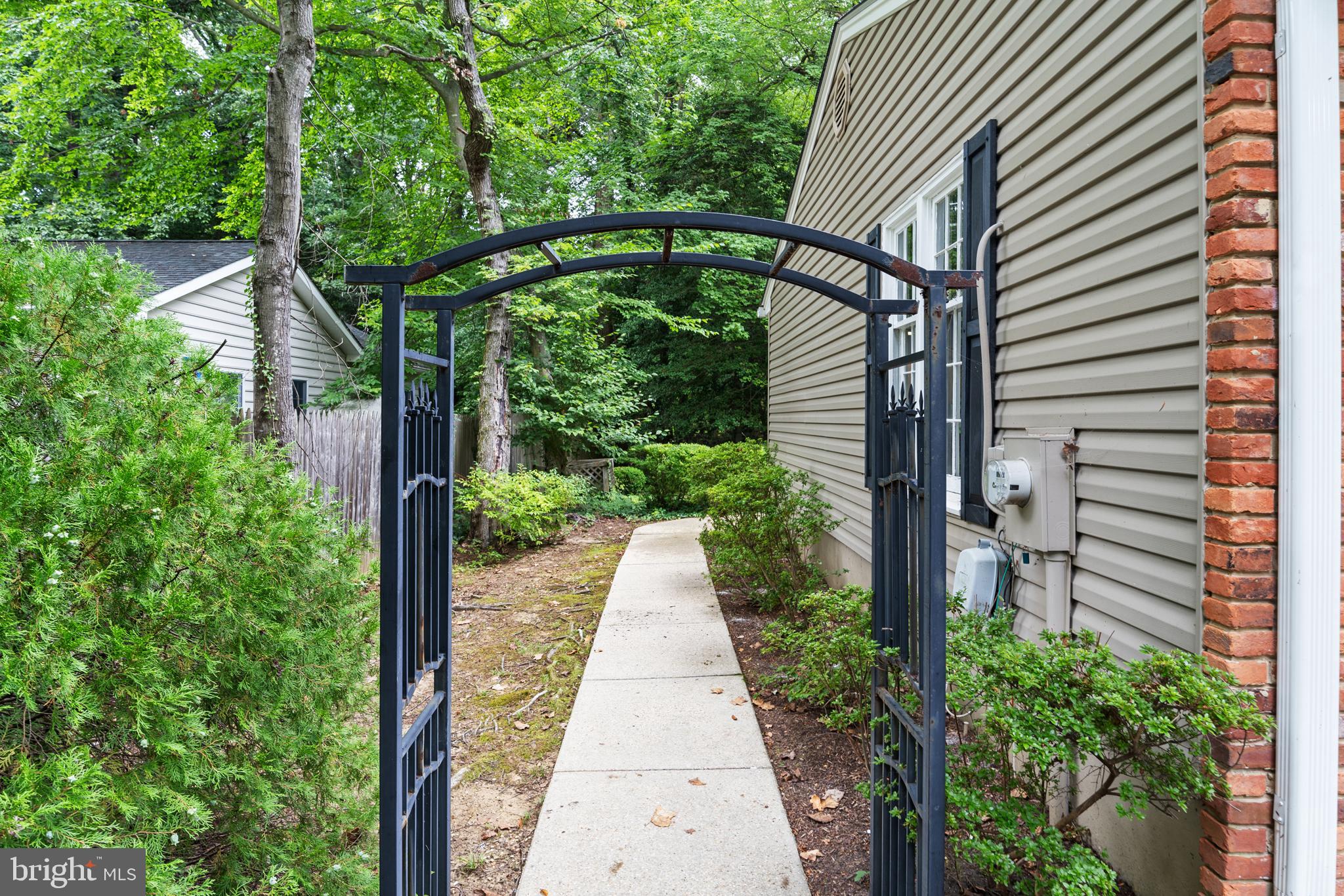 1643 Homewood Road Annapolis, MD 21409 - Photo 4 of 59 a view of a pathway of a house with plants