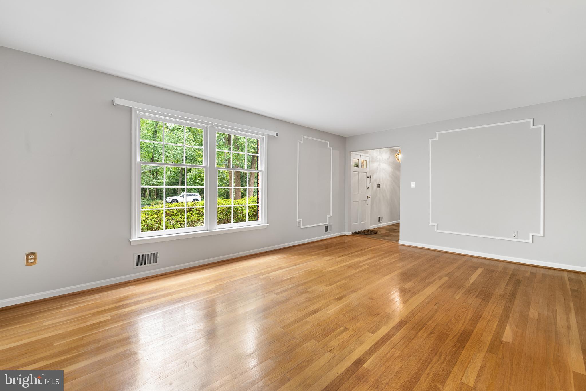 1643 Homewood Road Annapolis, MD 21409 - Photo 44 of 59 a view of an empty room with wooden floor and a window