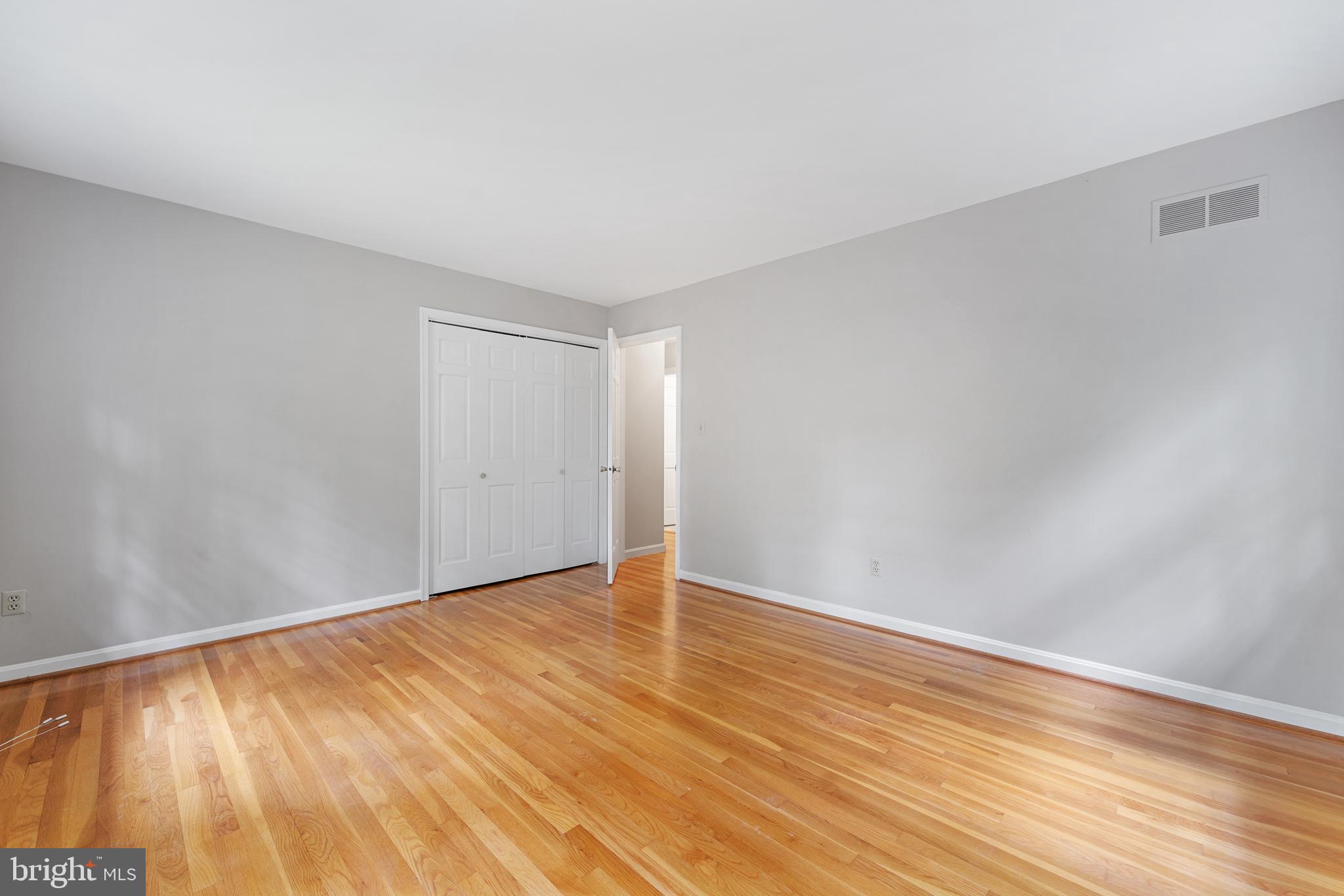 1643 Homewood Road Annapolis, MD 21409 - Photo 49 of 59 a view of an empty room with wooden floor