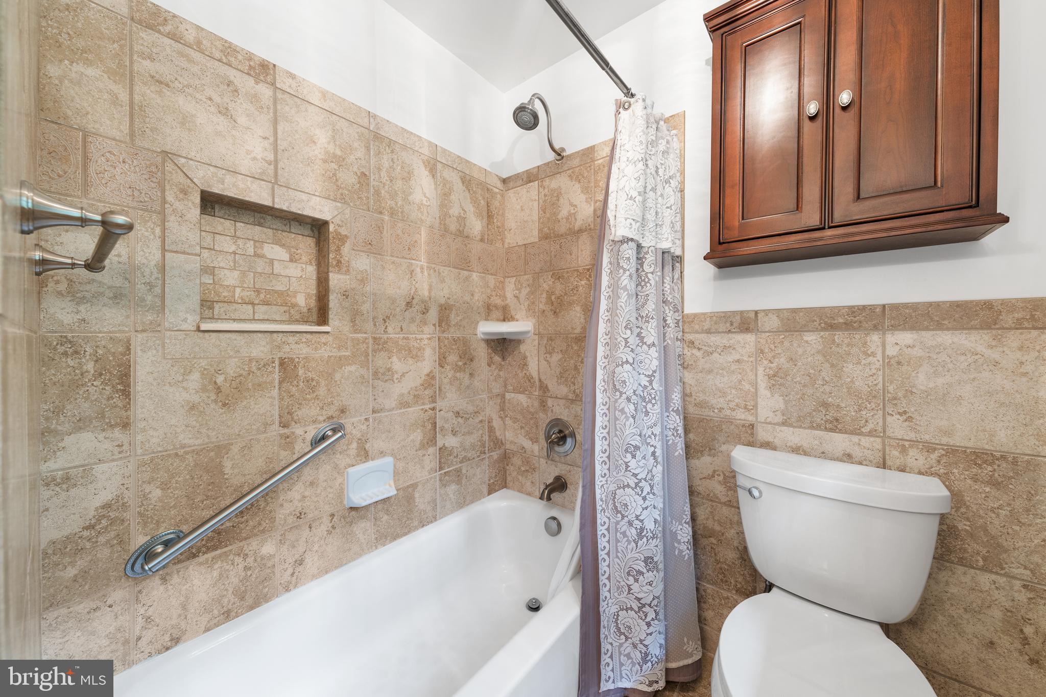 1643 Homewood Road Annapolis, MD 21409 - Photo 51 of 59 a bathroom with a toilet a sink and bathtub