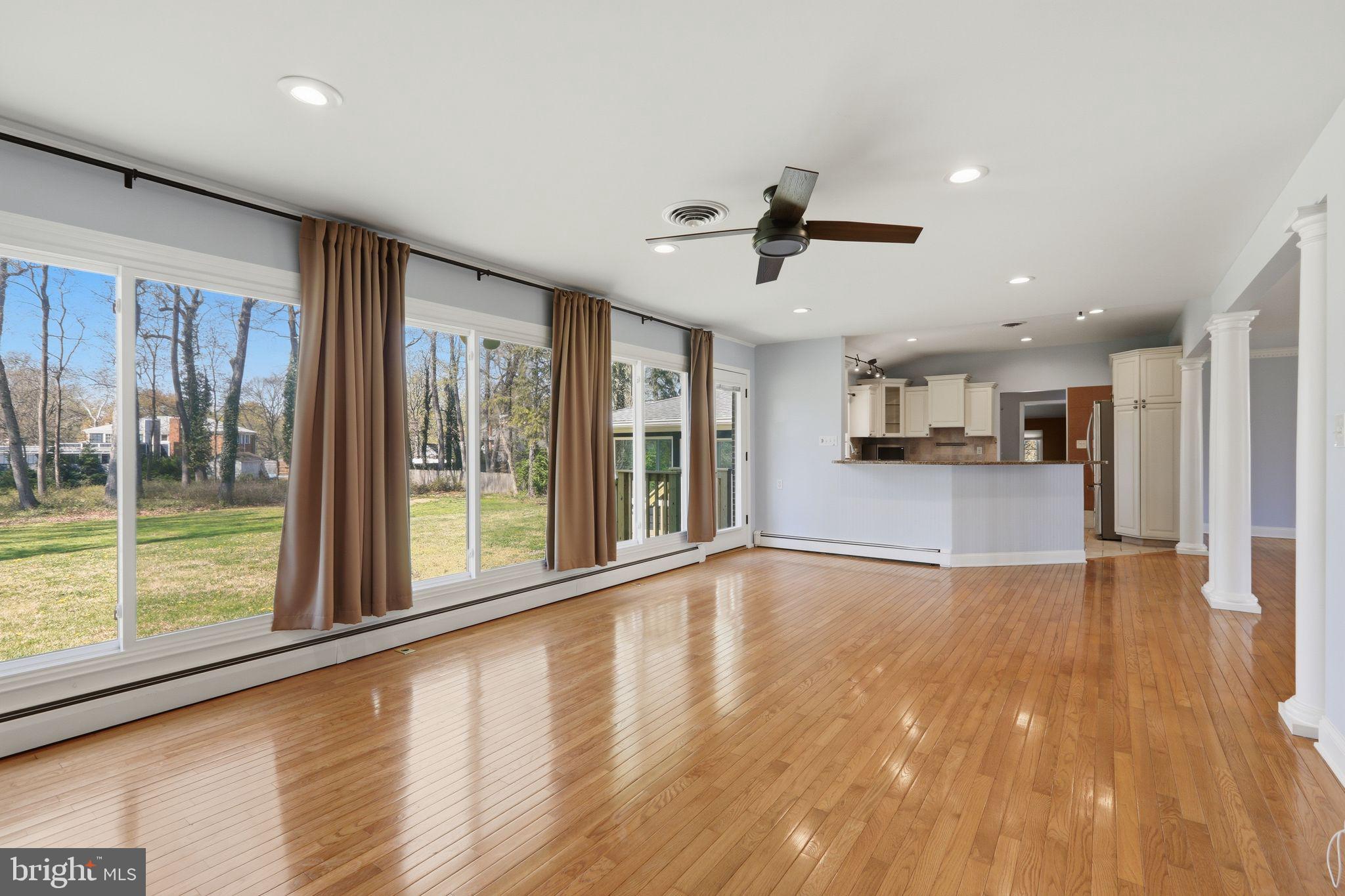 35 Oriole Way Moorestown, NJ 08057 - Photo 12 of 45 a view of an empty room with wooden floor and a window