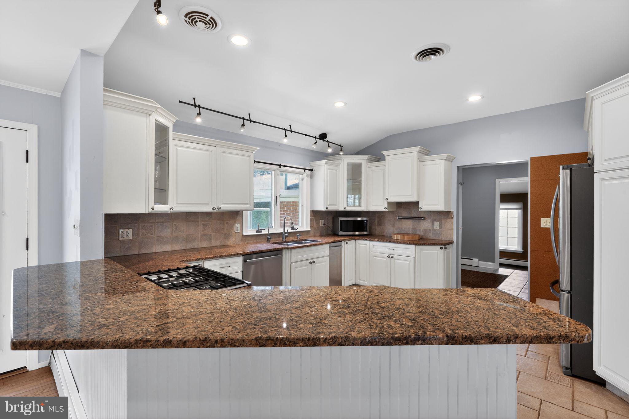35 Oriole Way Moorestown, NJ 08057 - Photo 13 of 45 a kitchen with stainless steel appliances granite countertop a sink stove and refrigerator