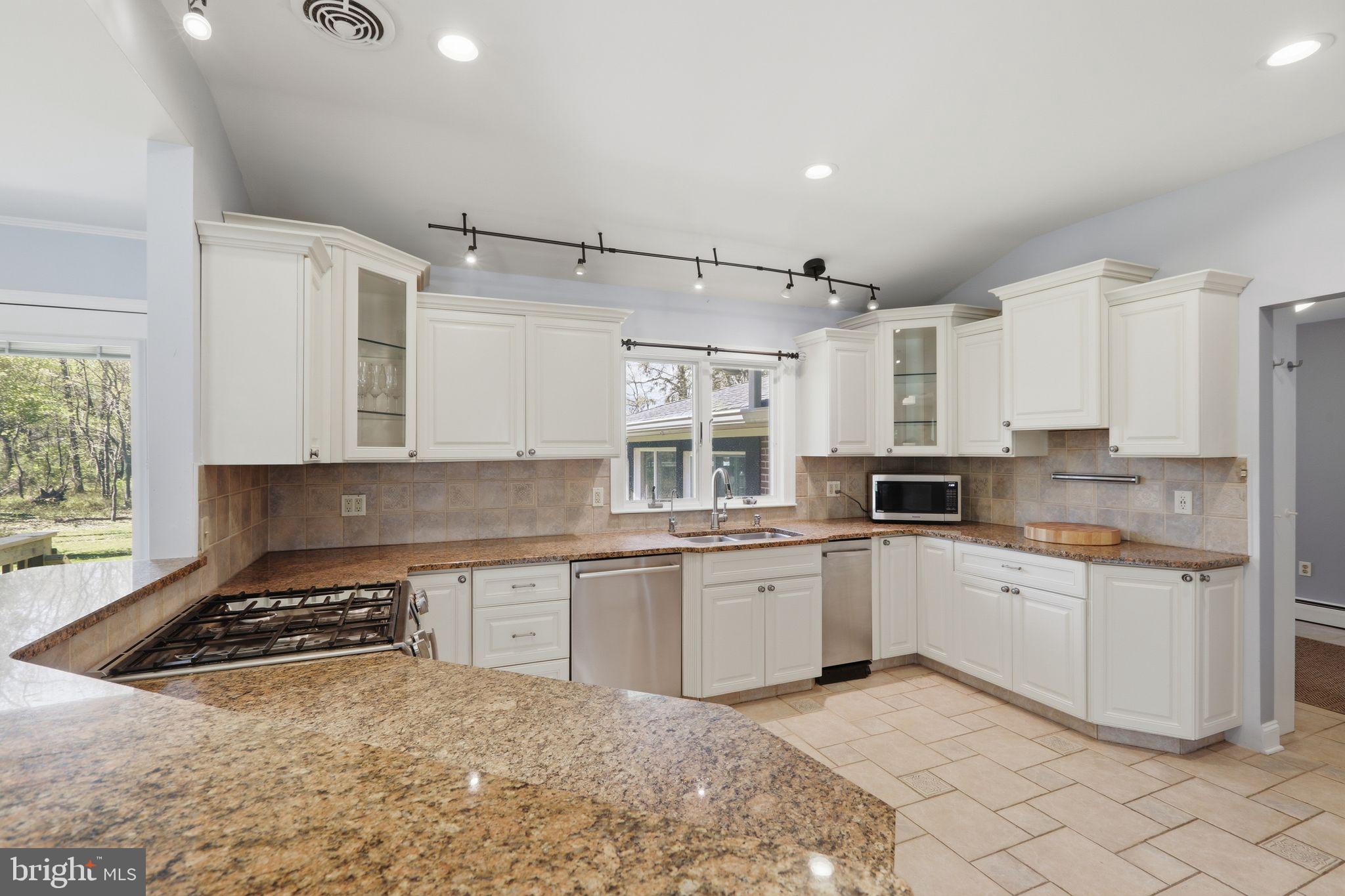 35 Oriole Way Moorestown, NJ 08057 - Photo 14 of 45 a kitchen with white cabinets and white appliances