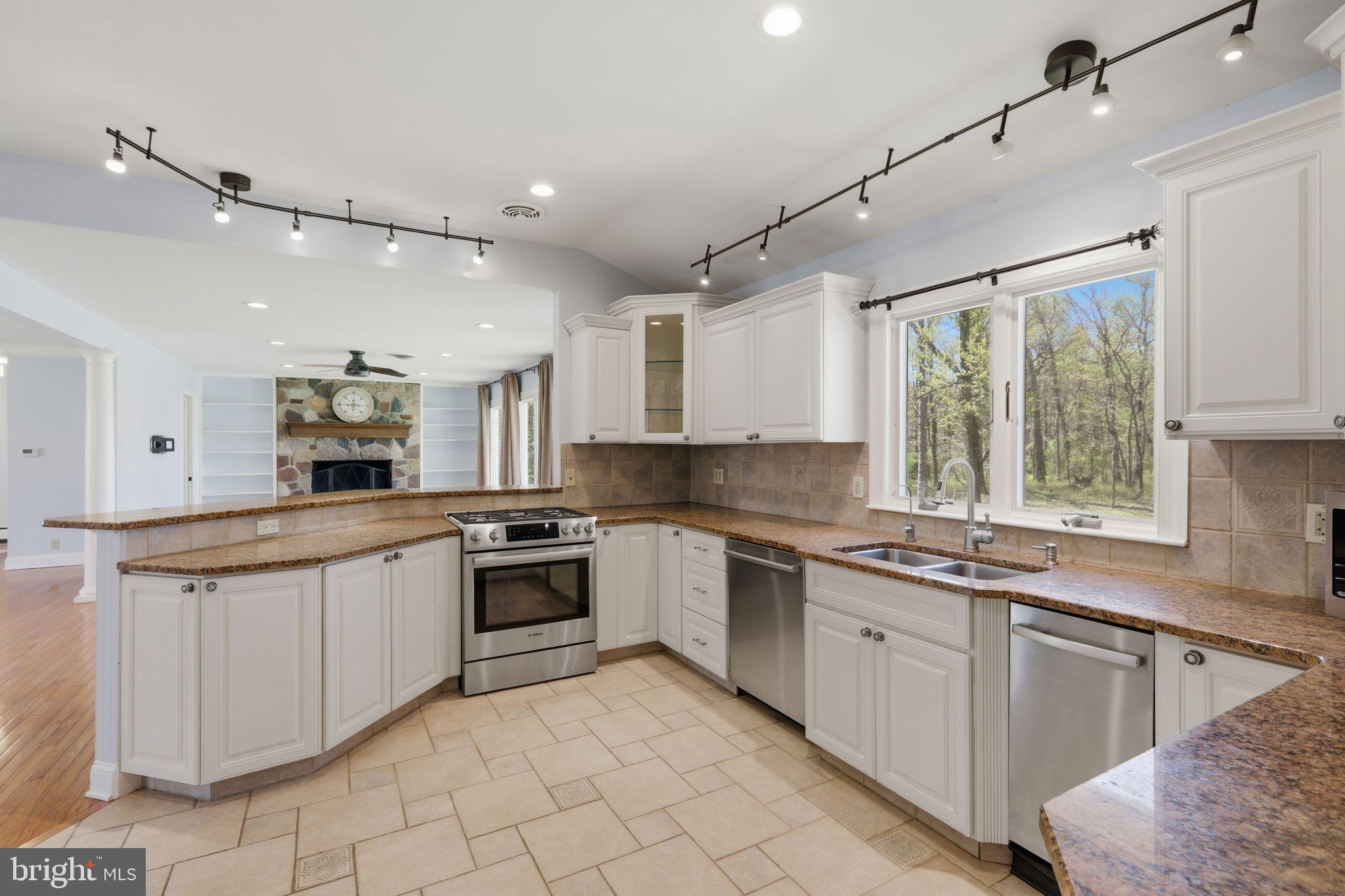 35 Oriole Way Moorestown, NJ 08057 - Photo 17 of 45 a kitchen with granite countertop white cabinets and white appliances