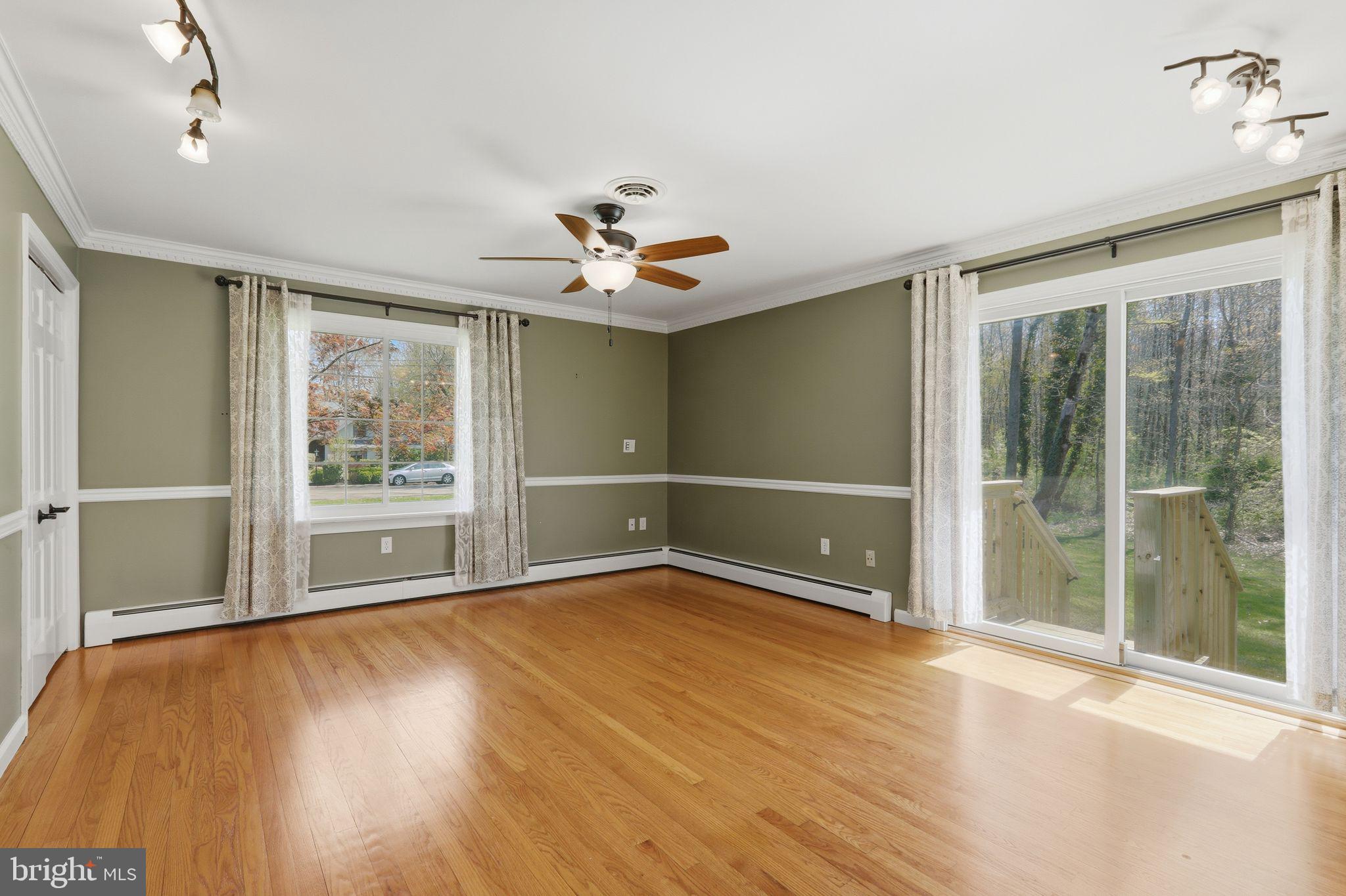 35 Oriole Way Moorestown, NJ 08057 - Photo 18 of 45 a view of an empty room with a window and wooden floor