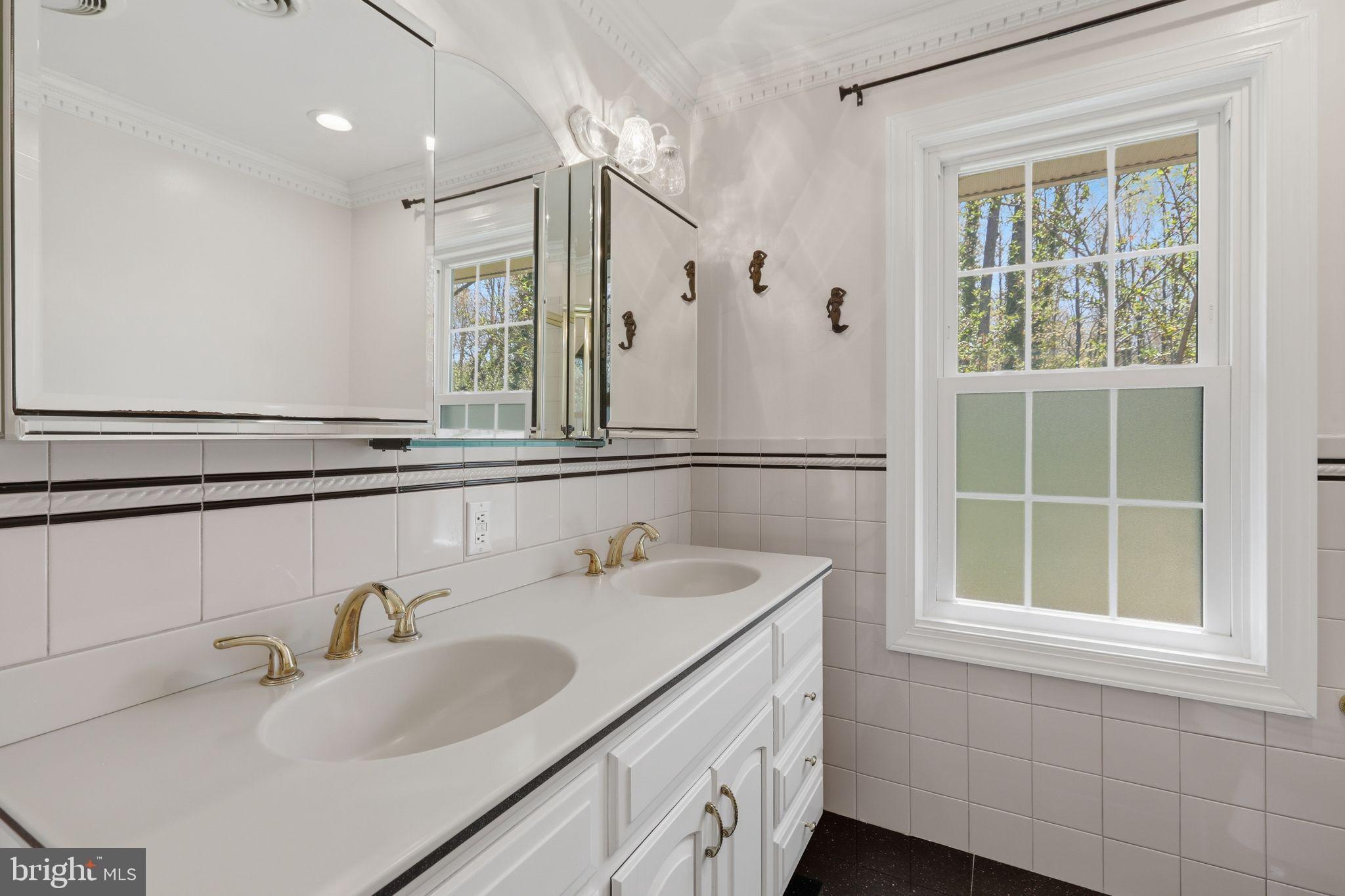 35 Oriole Way Moorestown, NJ 08057 - Photo 20 of 45 a bathroom with a sink and a window