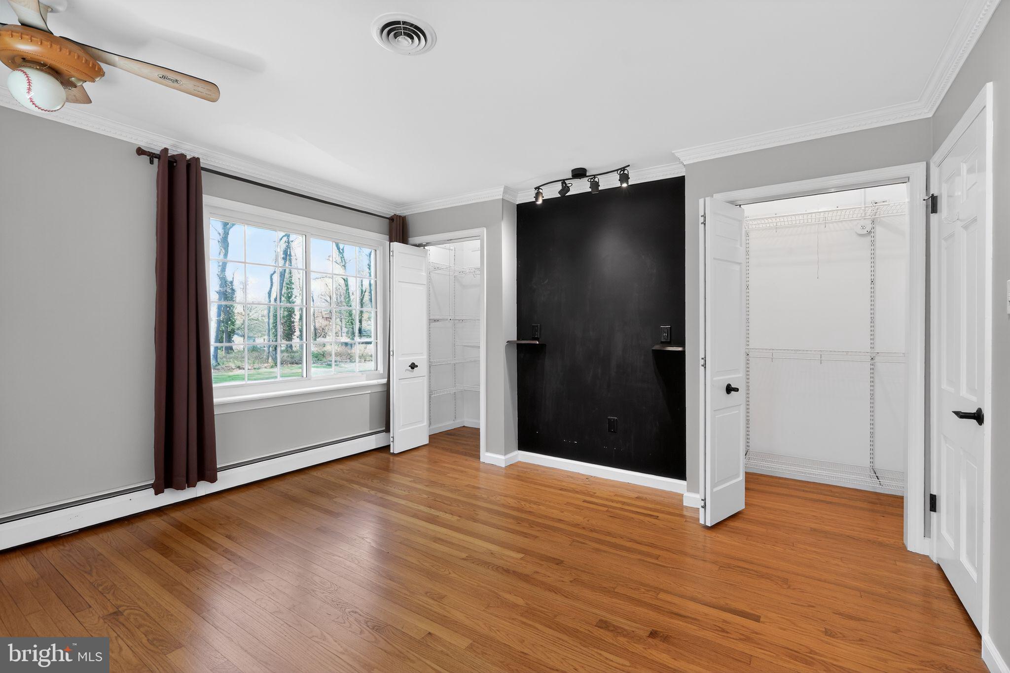 35 Oriole Way Moorestown, NJ 08057 - Photo 23 of 45 a view of an empty room with wooden floor and a window