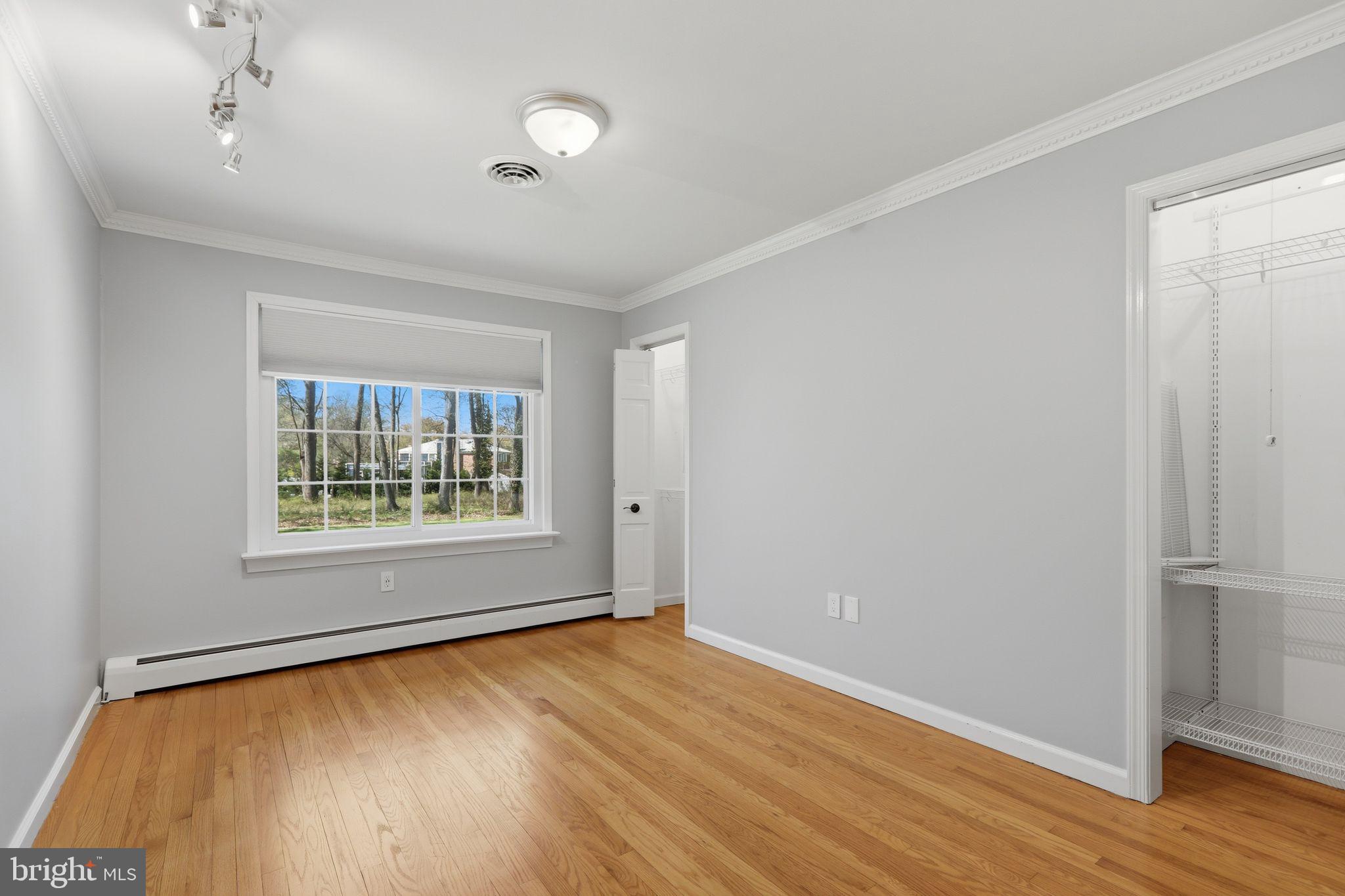 35 Oriole Way Moorestown, NJ 08057 - Photo 26 of 45 a view of an empty room with wooden floor and a window