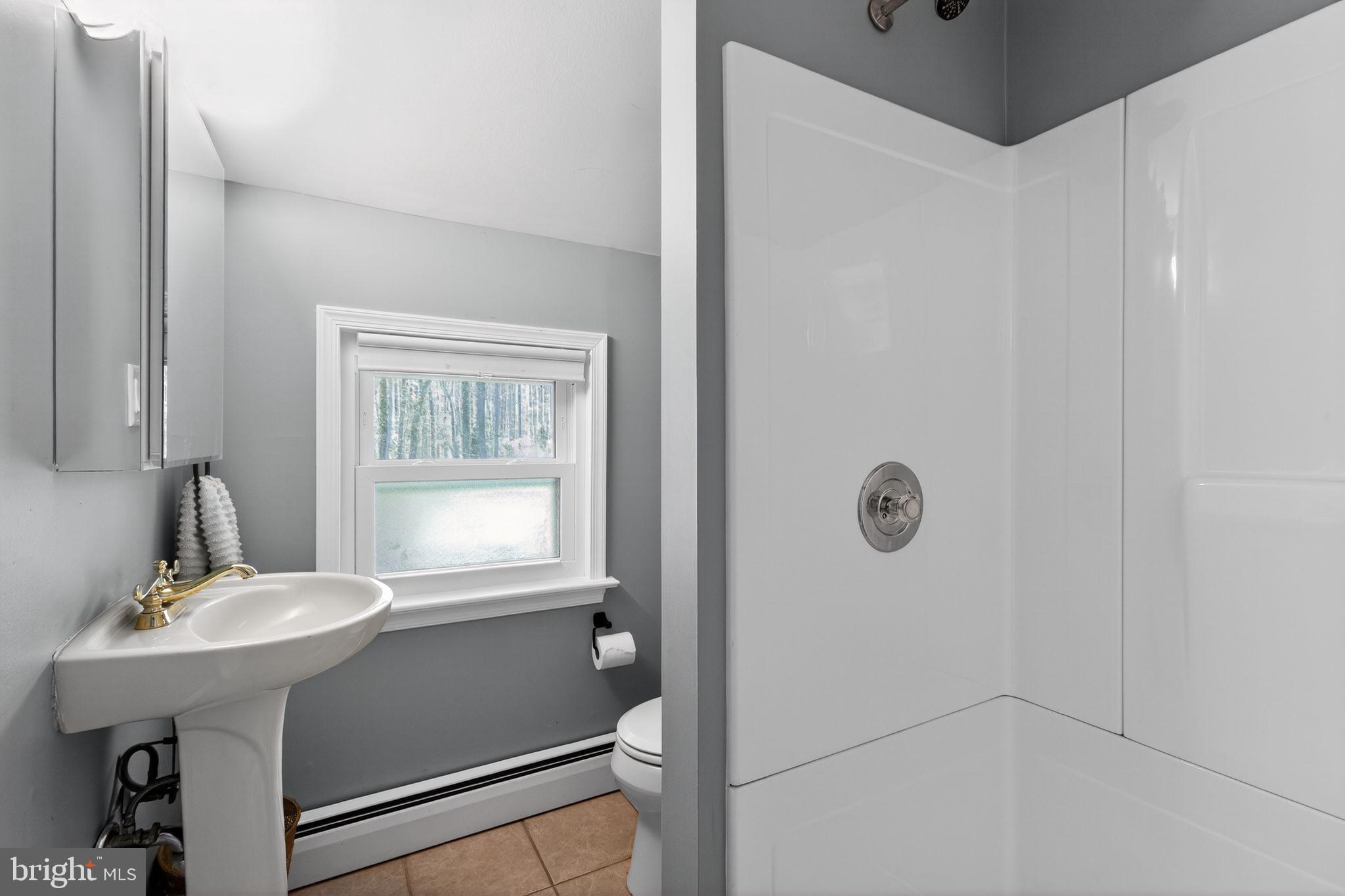 35 Oriole Way Moorestown, NJ 08057 - Photo 34 of 45 a bathroom with a sink a mirror and a window