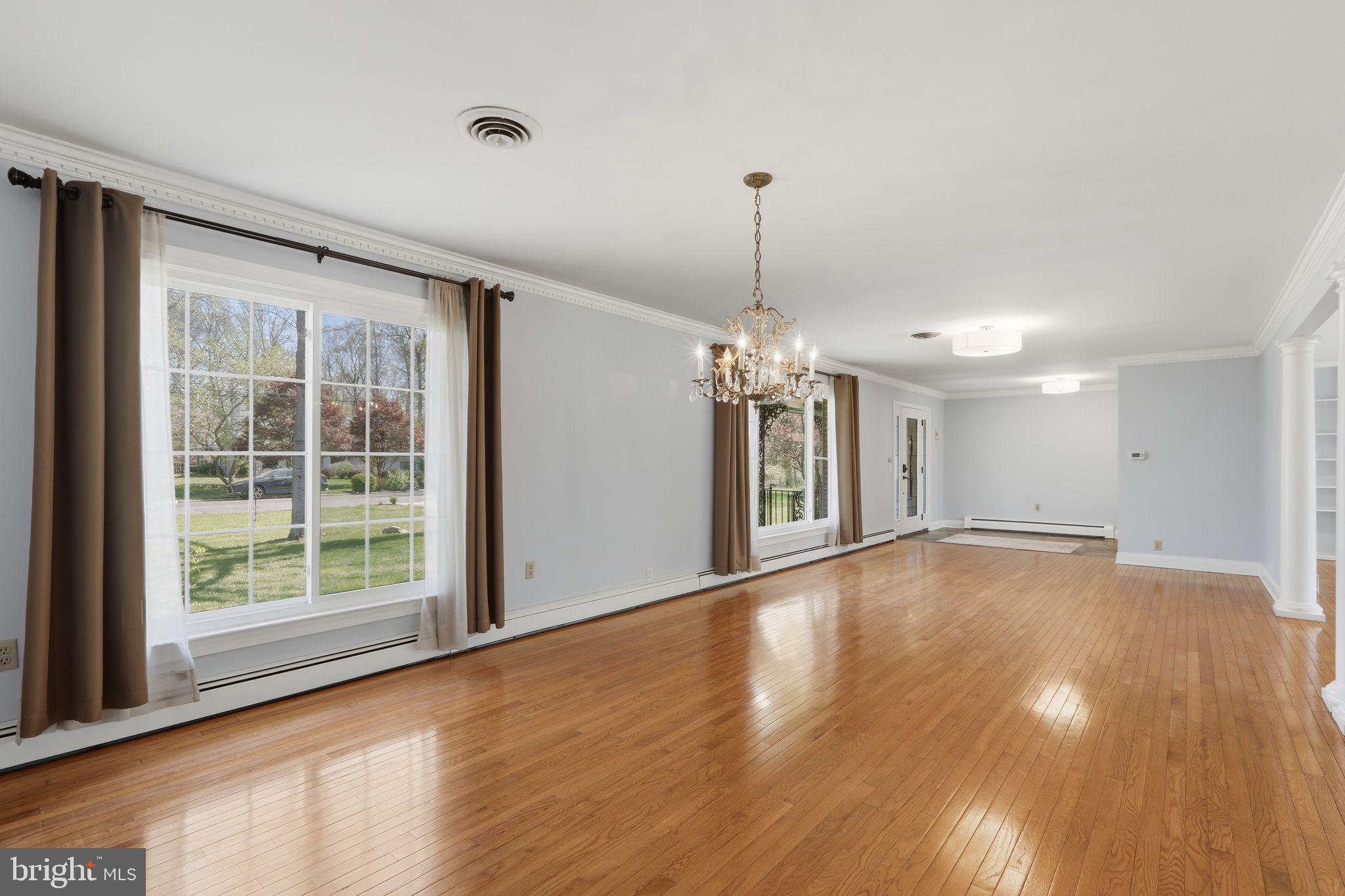 35 Oriole Way Moorestown, NJ 08057 - Photo 8 of 45 a view of an empty room with window and wooden floor