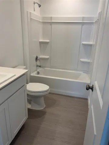 a bathroom with a toilet a sink and a bathtub