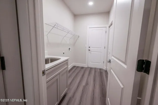 a view of hallway with washer and dryer