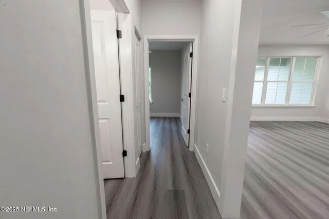 a bathroom with a toilet a sink and a mirror