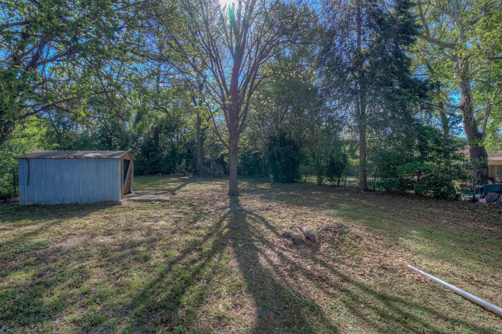 510 Constable Street Minden, LA 71055 - Photo 16 of 18 a backyard of a house with lots of green space