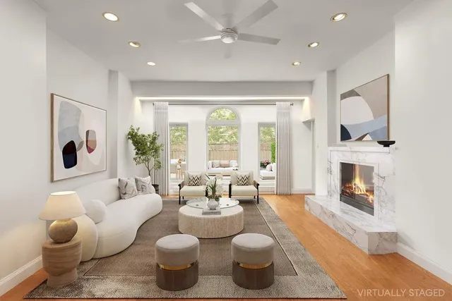 a living room with furniture and a fireplace