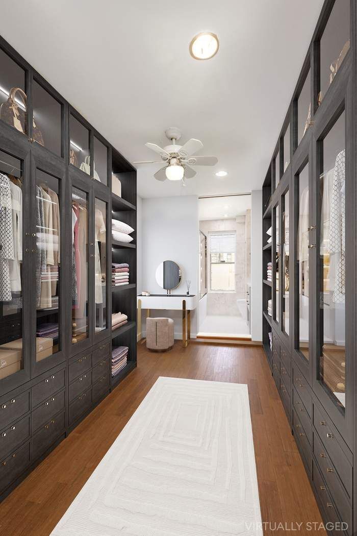 517 East 87th Street, Unit TRIPLEX Manhattan, NY 10128 - Photo 11 of 24 a spacious bedroom with a large bed and a chandelier