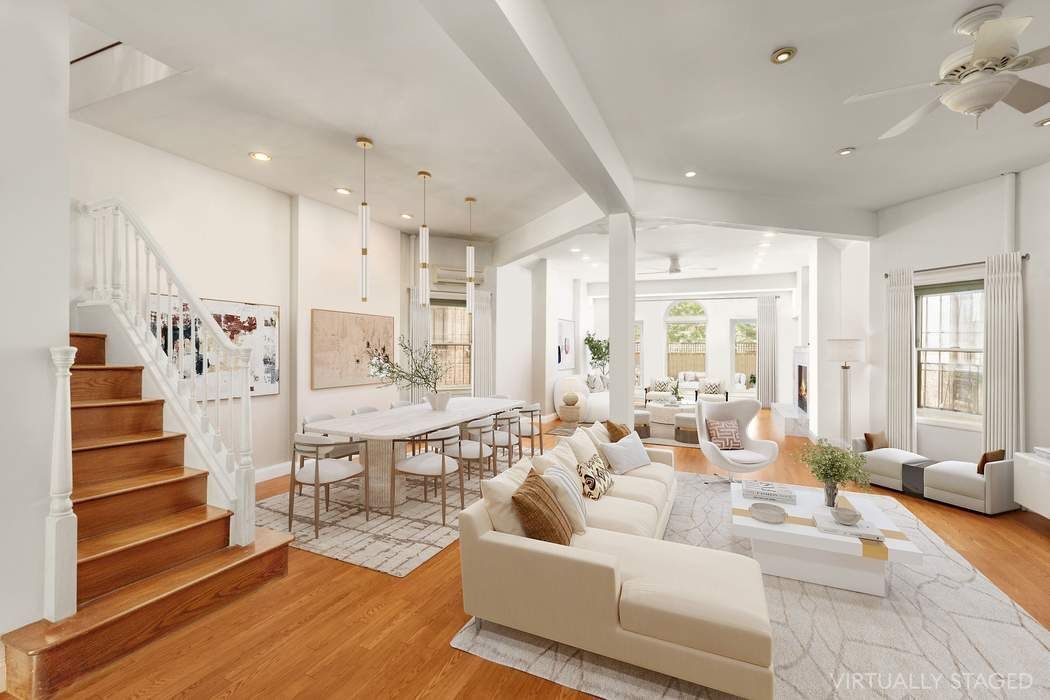 517 East 87th Street, Unit TRIPLEX Manhattan, NY 10128 - Photo 3 of 24 a living room with furniture and wooden floor