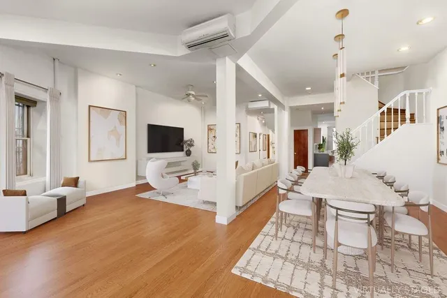 a very nice looking living room with a large window