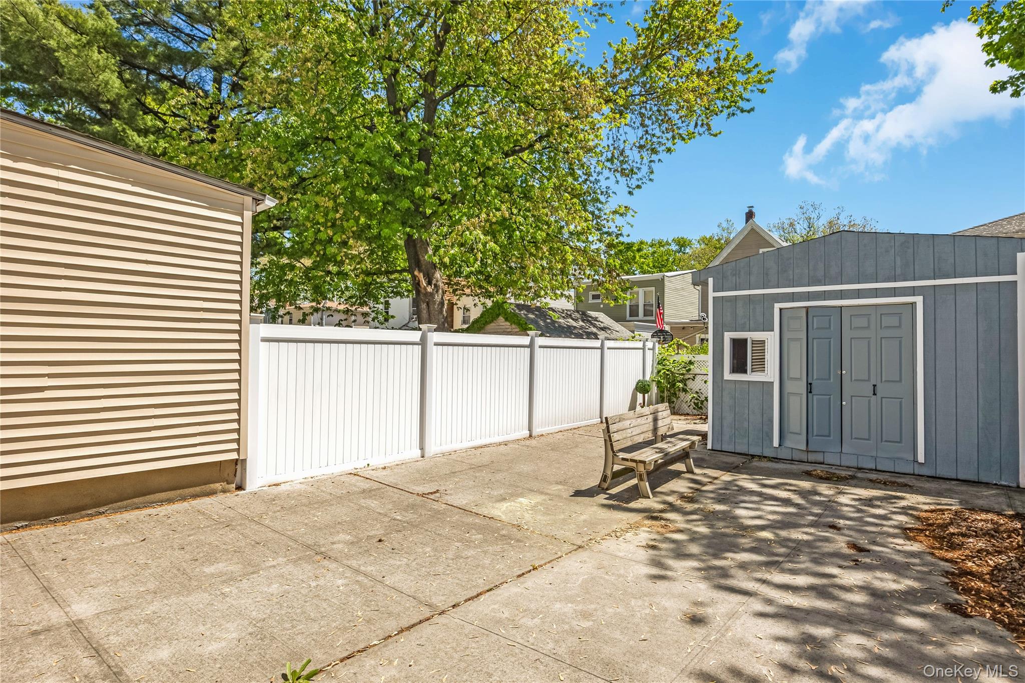80-50 88th Road Queens, NY 11421 - Photo 18 of 21 a view of a house with a yard