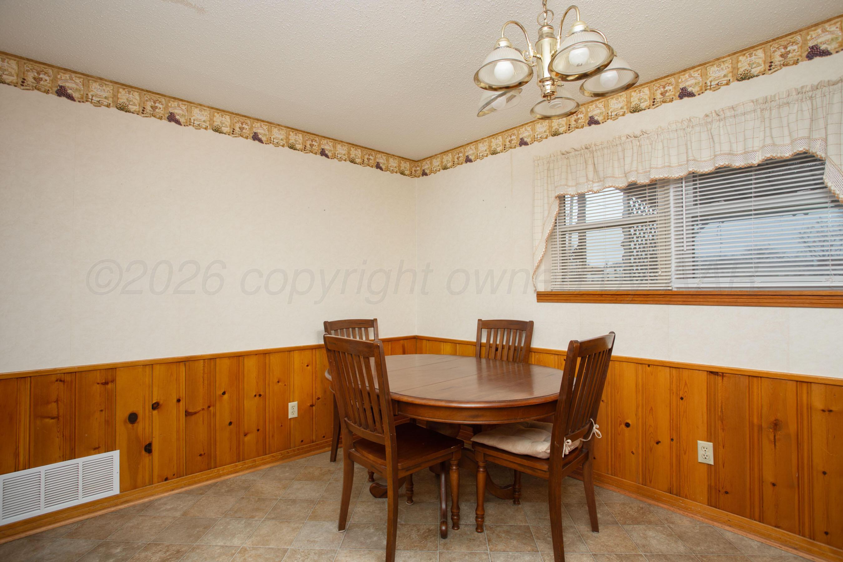 106 Renegade Trail Amarillo, TX 79108 - Photo 11 of 33 a view of a dining room with furniture and chandelier