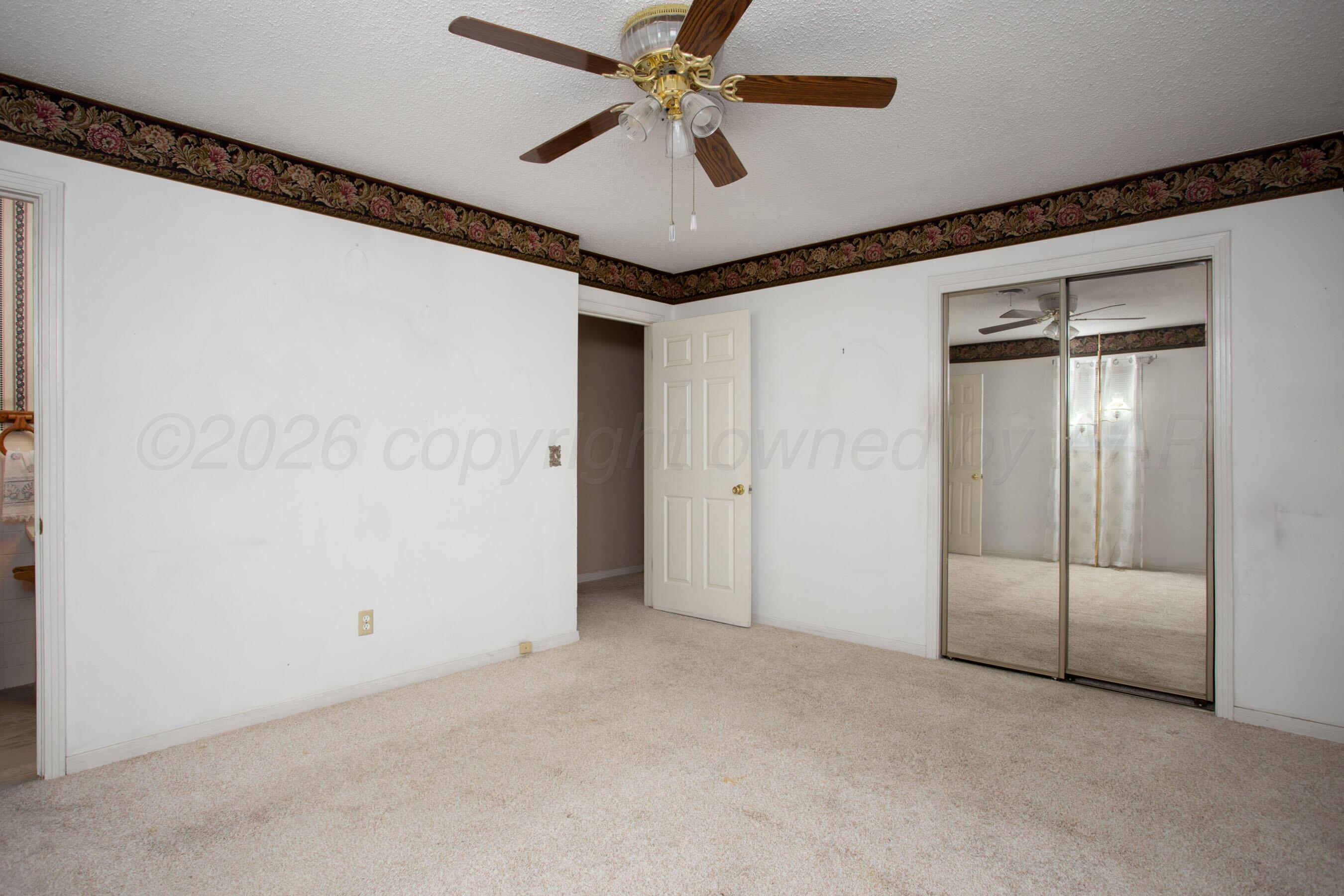 106 Renegade Trail Amarillo, TX 79108 - Photo 14 of 33 a view of a livingroom with a ceiling fan and hallway