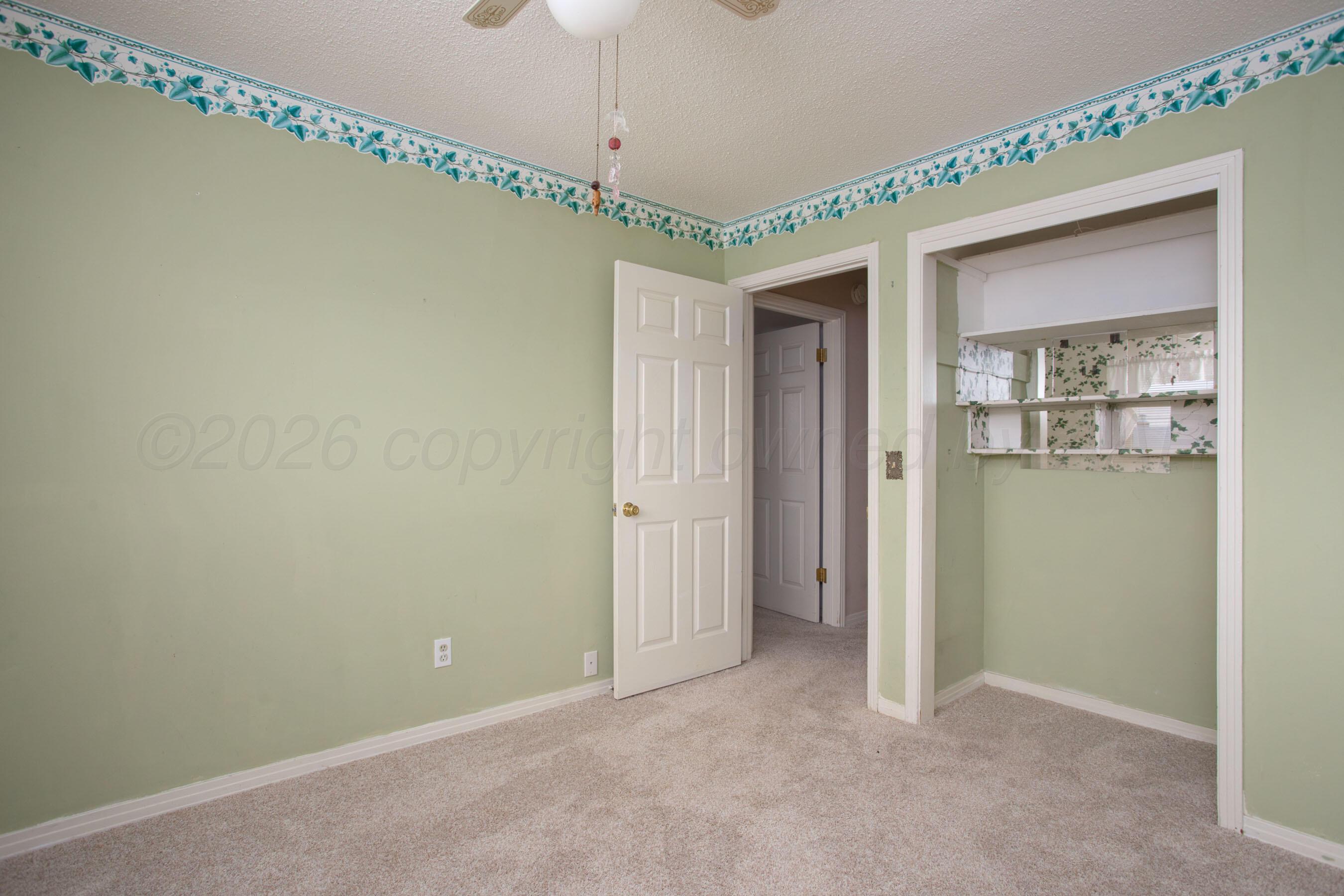 106 Renegade Trail Amarillo, TX 79108 - Photo 17 of 33 a view of an empty room with a window