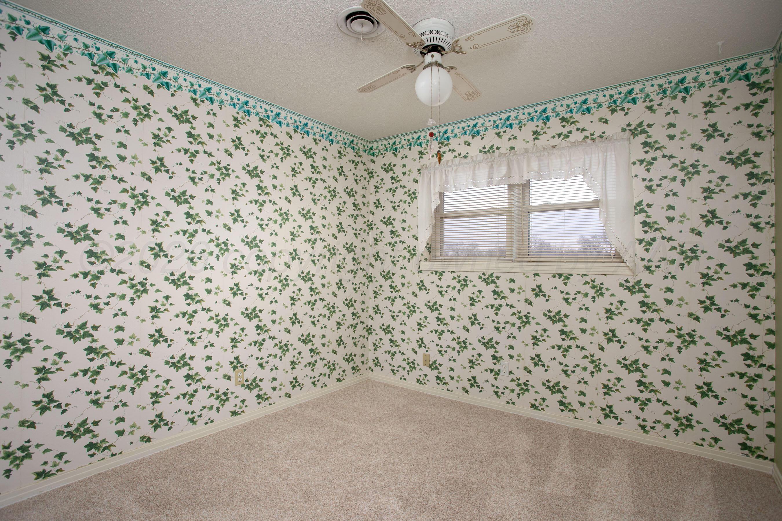 106 Renegade Trail Amarillo, TX 79108 - Photo 18 of 33 a bathroom with a shower curtain and a sink