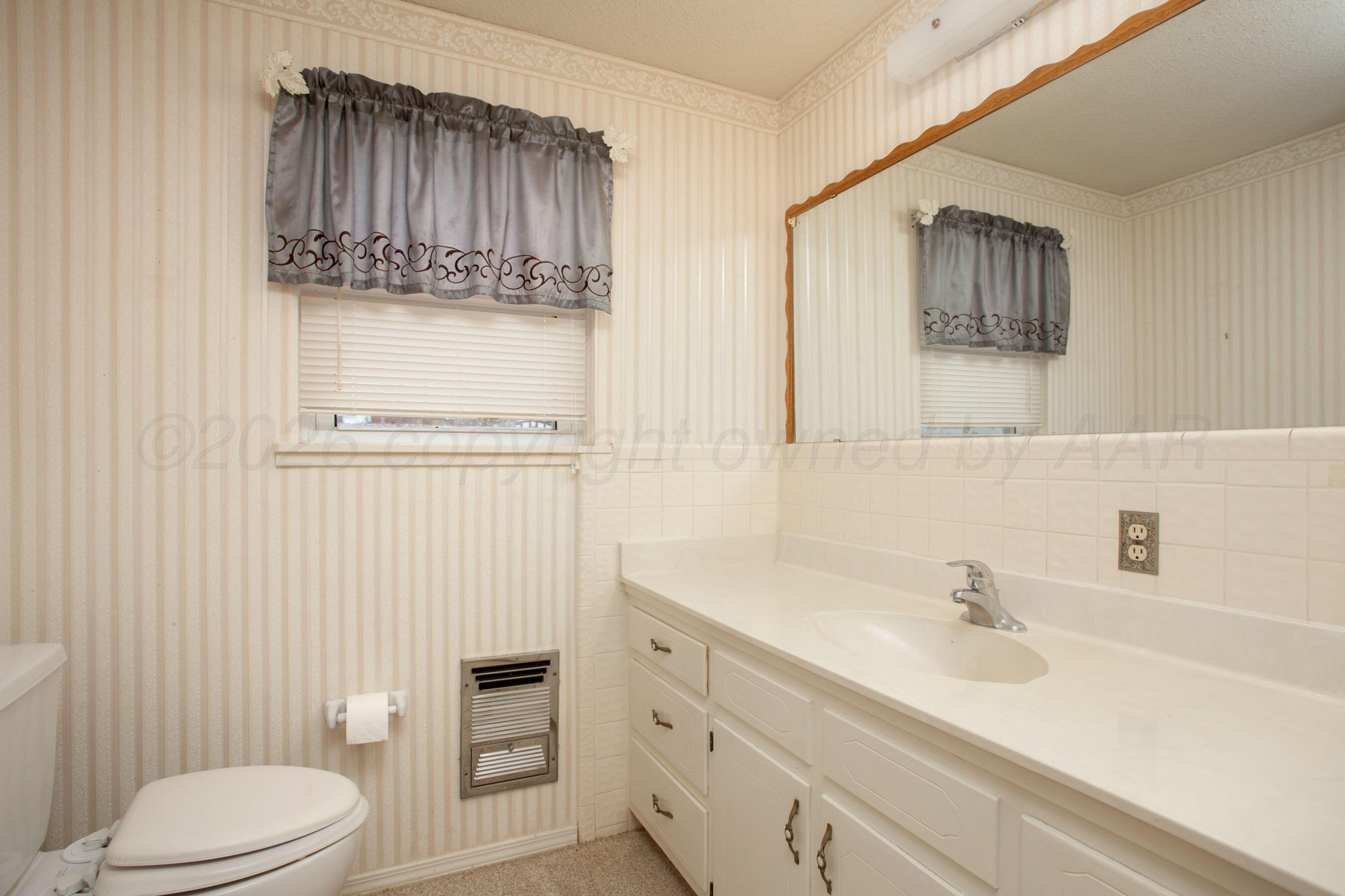 106 Renegade Trail Amarillo, TX 79108 - Photo 20 of 33 a bathroom with a sink a toilet and shower