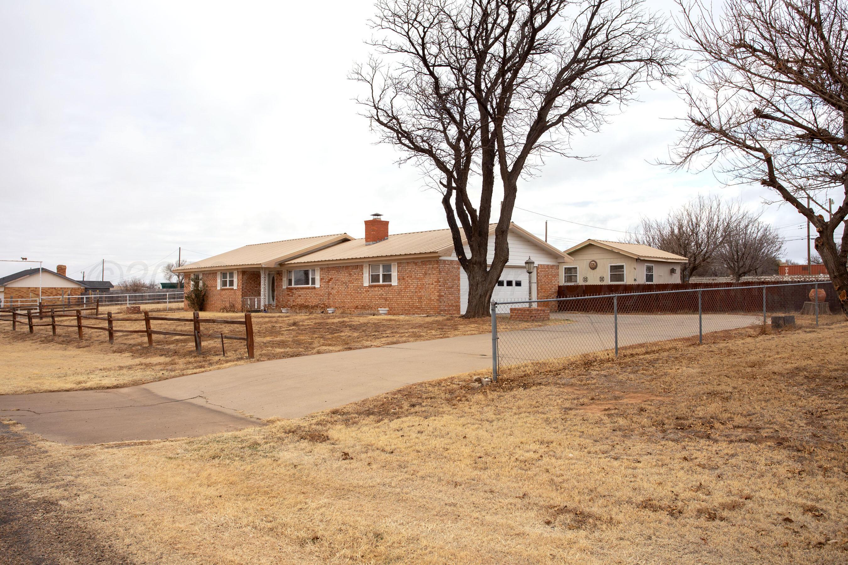106 Renegade Trail Amarillo, TX 79108 - Photo 2 of 33 a front view of a house with a yard
