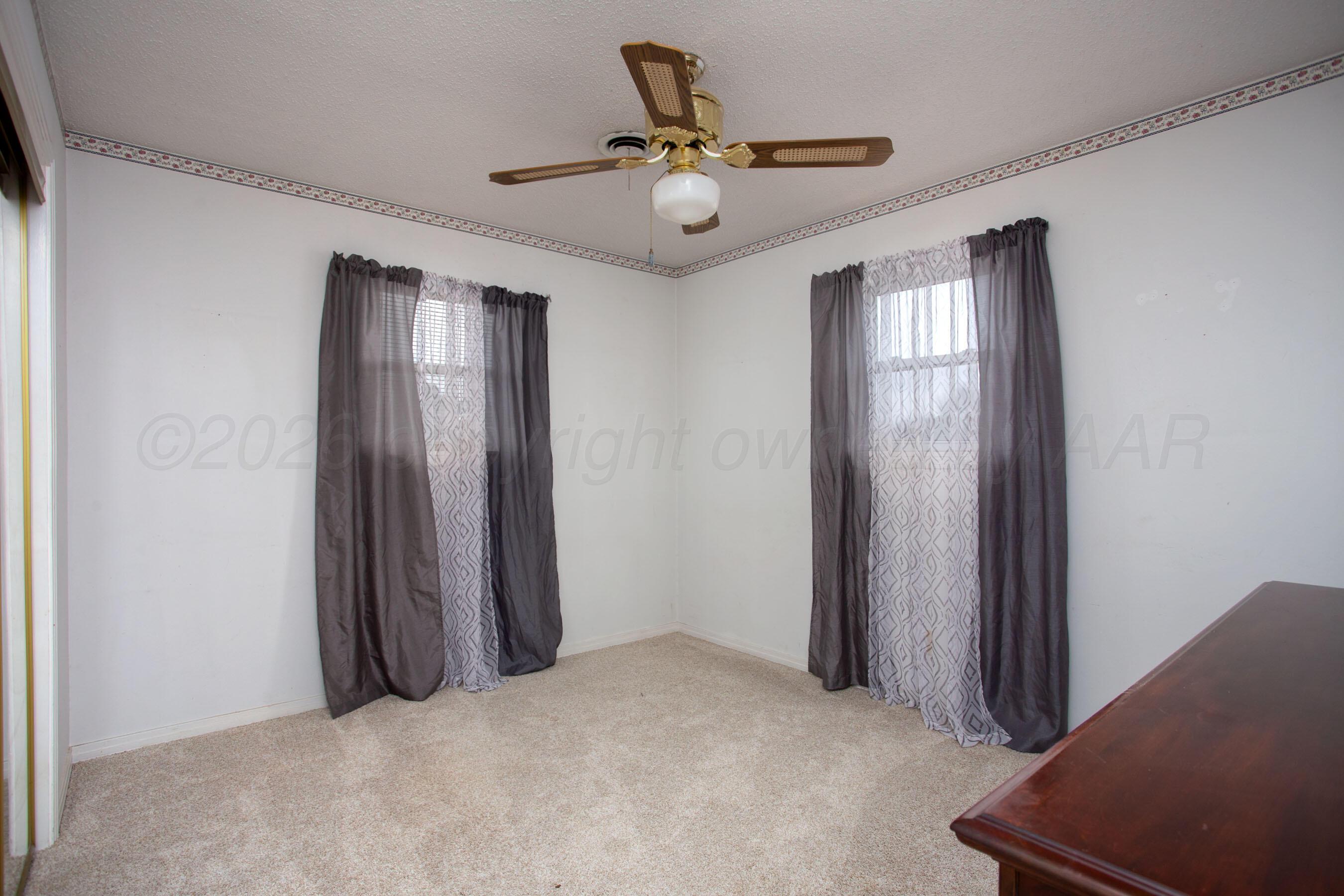106 Renegade Trail Amarillo, TX 79108 - Photo 21 of 33 a view of a livingroom with a piano and wooden floor