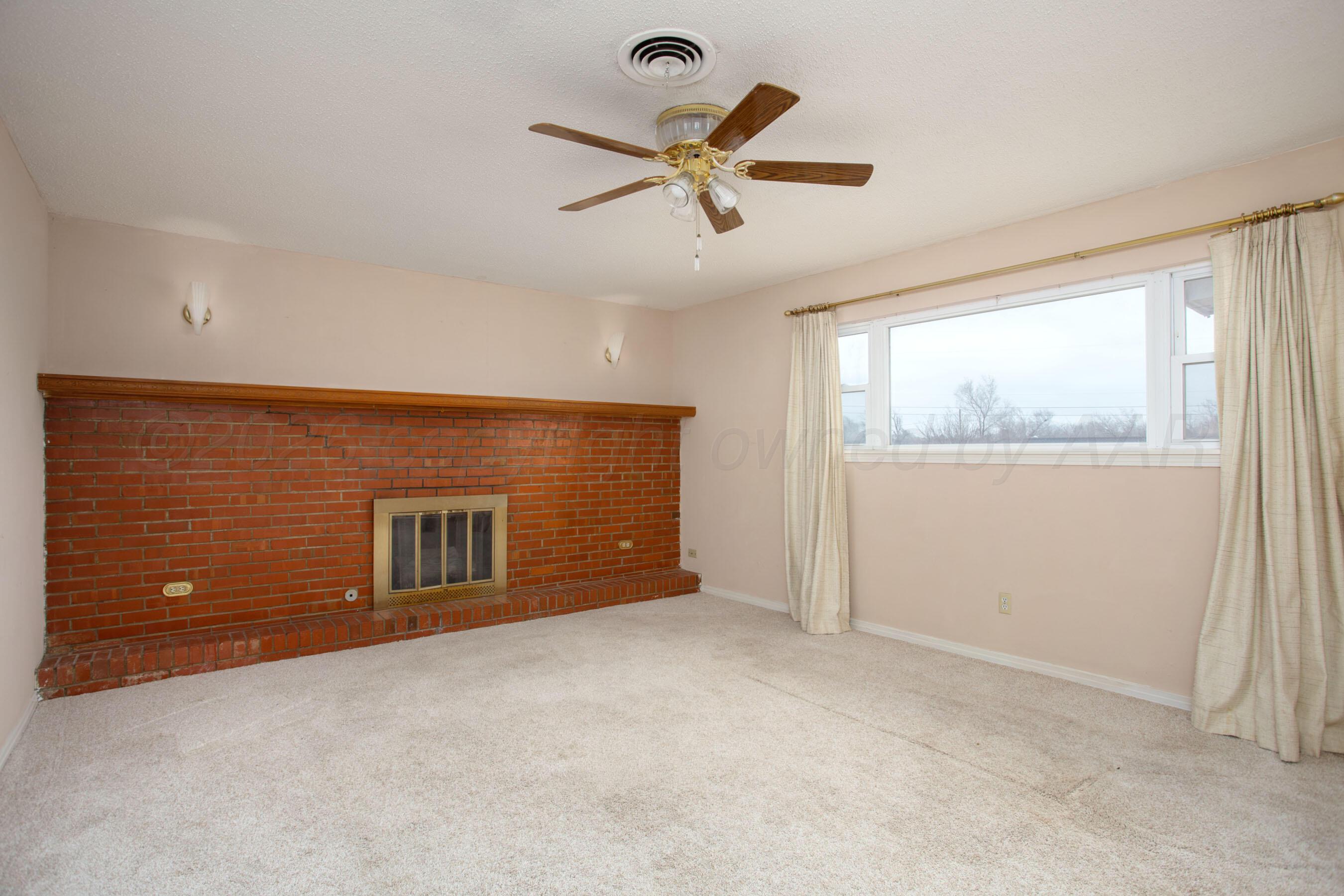 106 Renegade Trail Amarillo, TX 79108 - Photo 6 of 33 a view of an empty room with a window