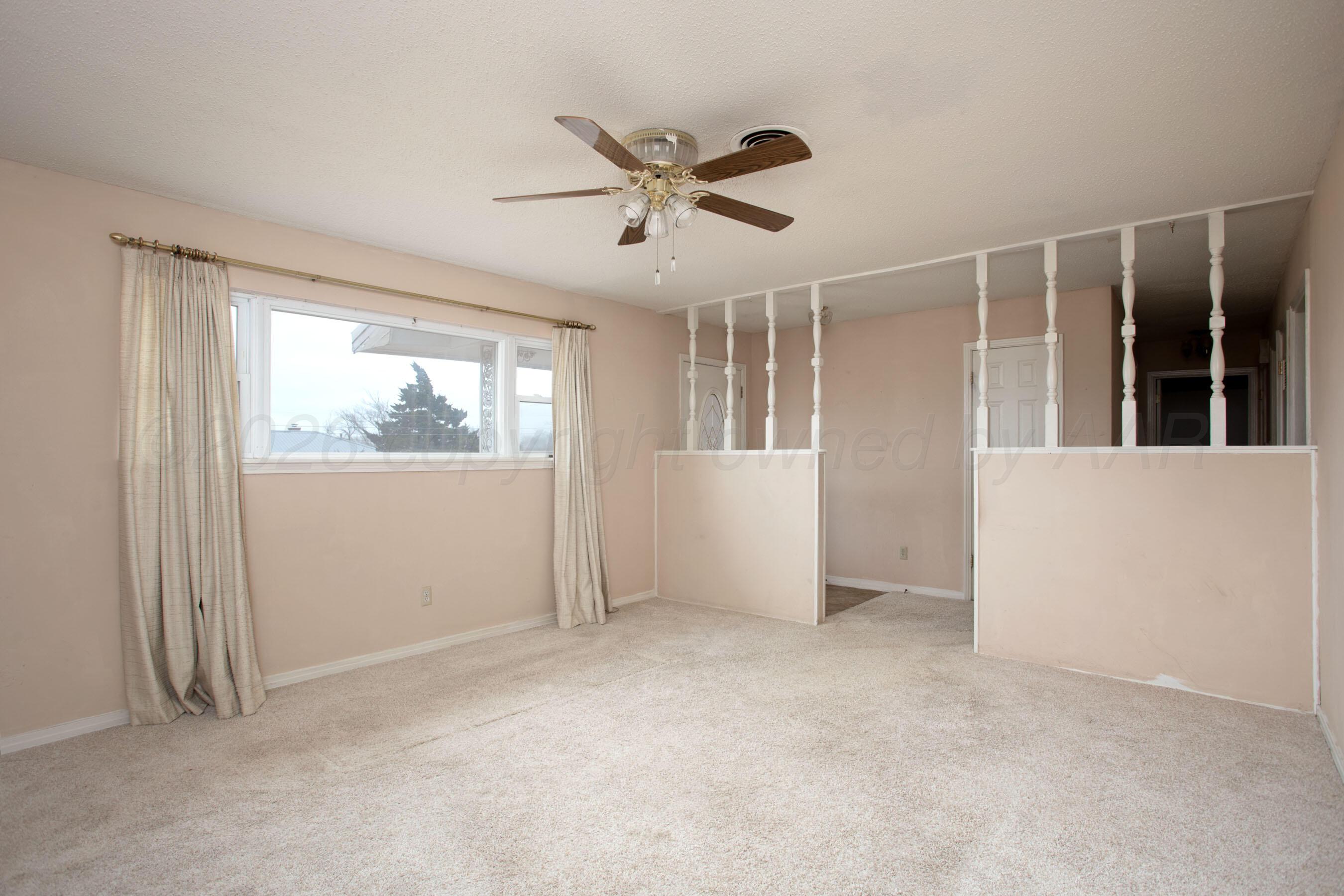 106 Renegade Trail Amarillo, TX 79108 - Photo 7 of 33 a view of an empty room with a window