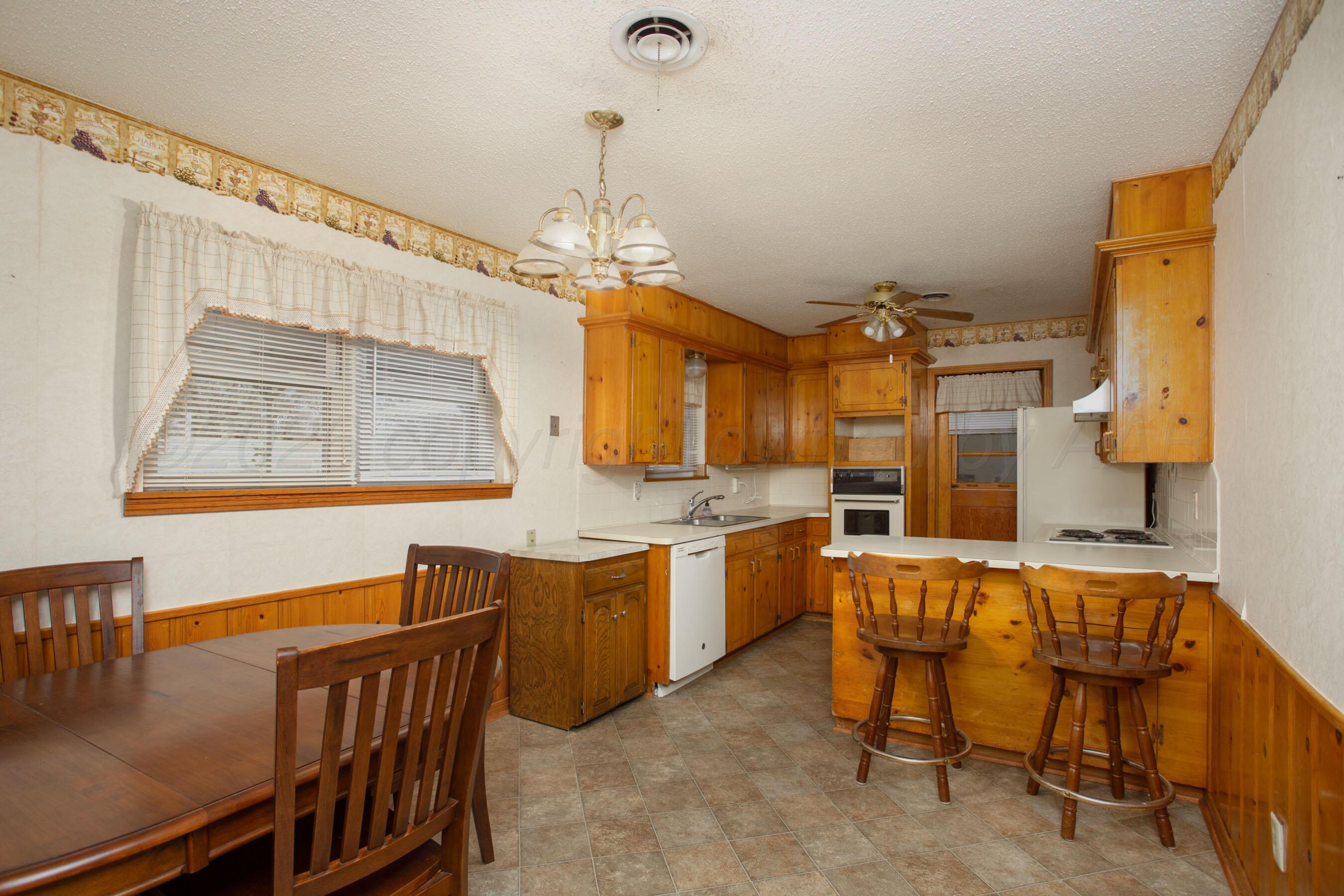 106 Renegade Trail Amarillo, TX 79108 - Photo 9 of 33 a view of a kitchen and dining room