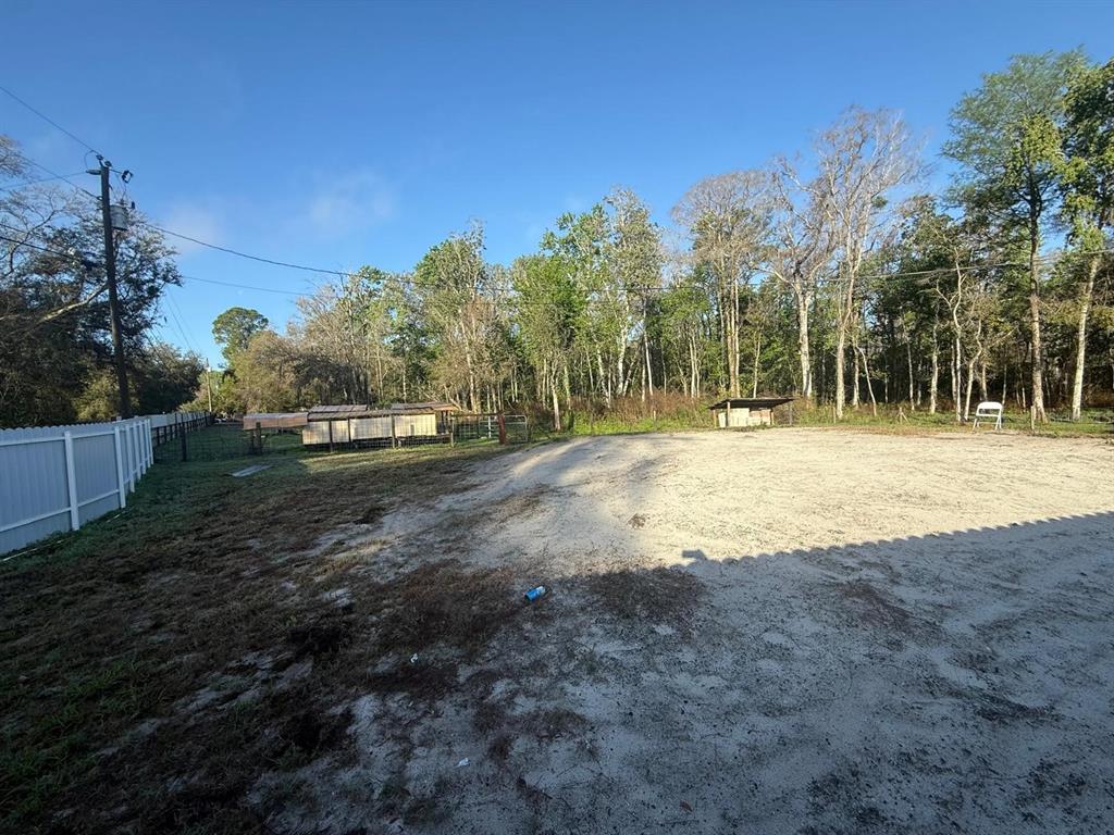 17151 Lemon Street Spring Hill, FL 34610 - Photo 16 of 18 a backyard of a house with lots of green space