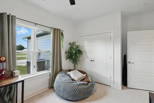 a living room with furniture and a window