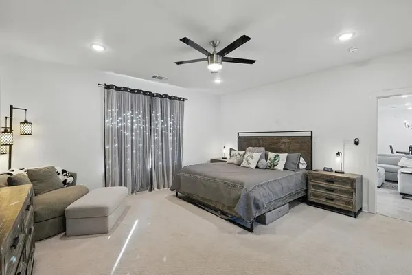 a bedroom with bed and window