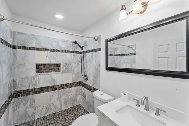 a bathroom with a shower and a sink