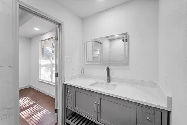 a bathroom with a sink double vanity and a mirror