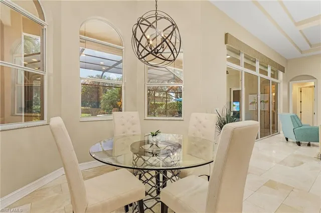 a view of a dining room with furniture and windows