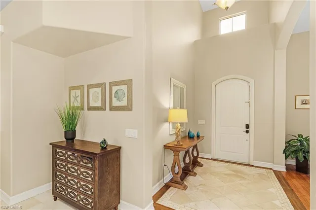 a view of a workspace with furniture and wooden floor