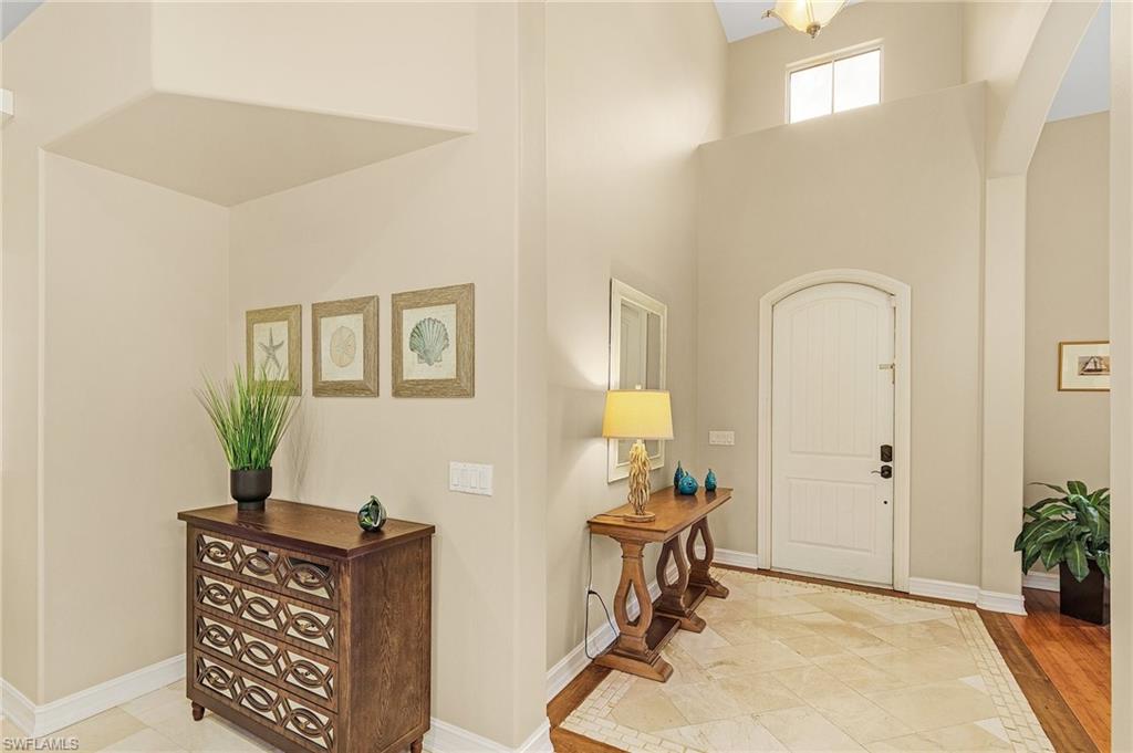 20002 Grande Lake Drive Estero, FL 33928 - Photo 13 of 38 a view of a workspace with furniture and wooden floor