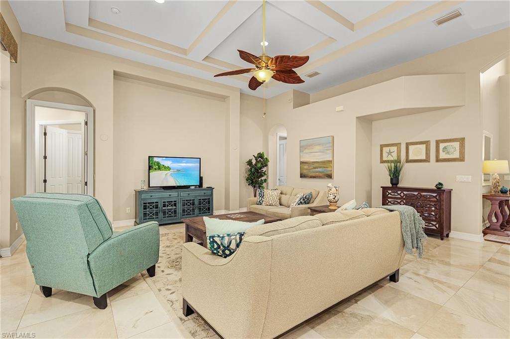 20002 Grande Lake Drive Estero, FL 33928 - Photo 15 of 38 a living room with furniture and a flat screen tv