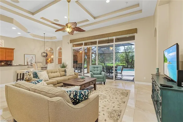 a living room with fireplace furniture and a flat screen tv