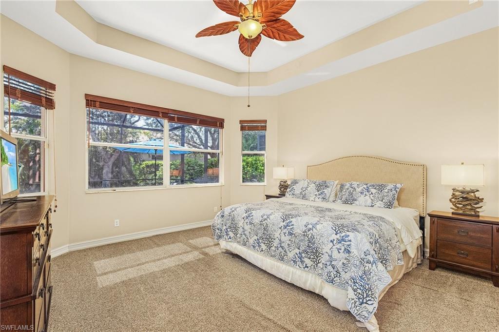 20002 Grande Lake Drive Estero, FL 33928 - Photo 17 of 38 a bedroom with a large bed and a window