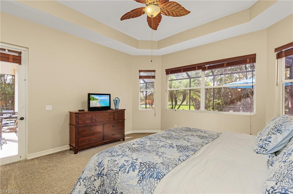 20002 Grande Lake Drive Estero, FL 33928 - Photo 18 of 38 a bedroom with a bed and a window