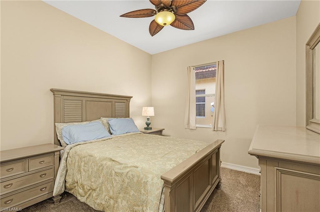 20002 Grande Lake Drive Estero, FL 33928 - Photo 20 of 38 a bedroom with a bed and a window