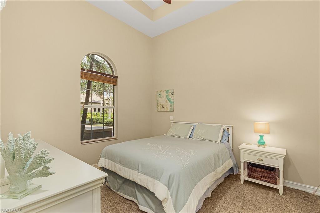 20002 Grande Lake Drive Estero, FL 33928 - Photo 21 of 38 a bedroom with a bed and a window